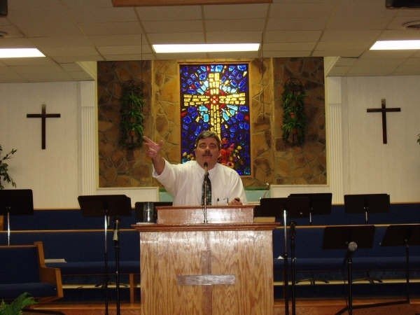 Pastor Buddy Burnett preaching at Connections Community Church